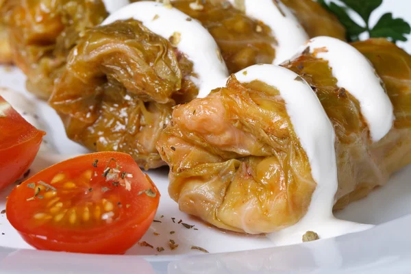 Stuffed cabbage rolls with  tomato macro. horizontal — Stock Photo, Image