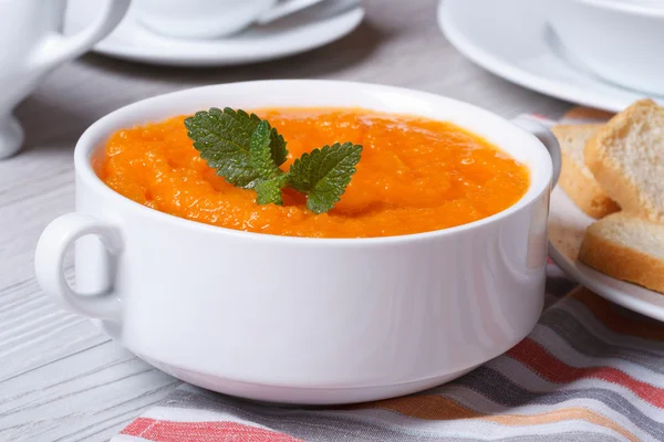 Cream soup of carrots close-up in white plate — Stock Photo, Image