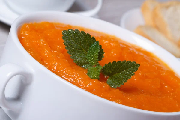 Healthy vegetable cream soup of carrots macro — Stock Photo, Image