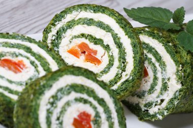 Chopped spinach roulade with cream cheese macro clipart