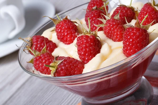 Delicate raspberry dessert in a glass close up on the table — Stock Photo, Image