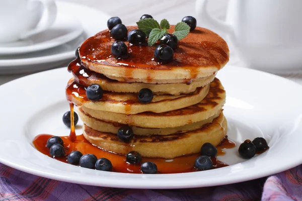 Pancake with fresh blueberries, mint and maple syrup — Stock Photo, Image