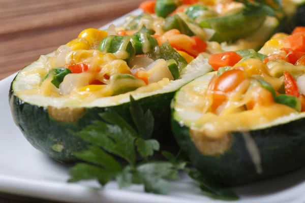 Tasty baked zucchini stuffed with vegetables macro — Stock Photo, Image
