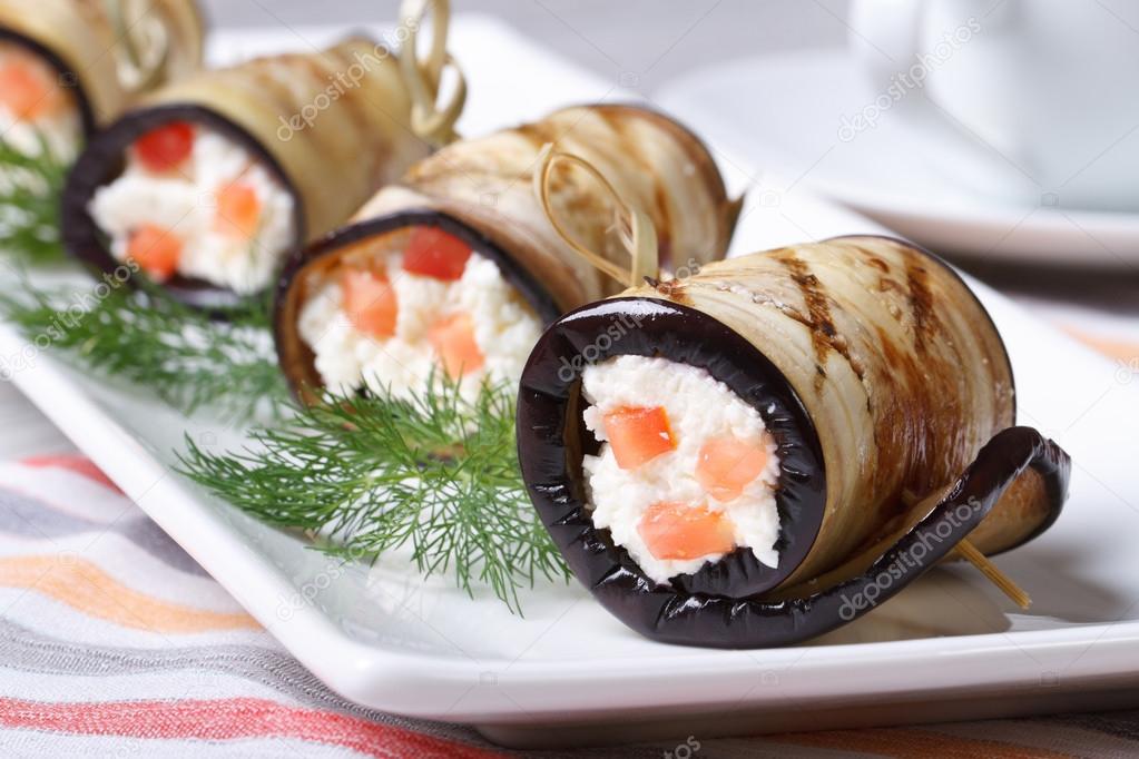 Eggplant rolls stuffed with cream cheese and tomatoes