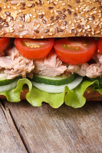 Delicious sandwich with tuna and vegetables macro. vertical — Stock Photo, Image