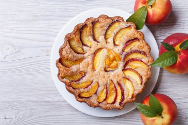 peach pie and fresh fruit on a wooden top view