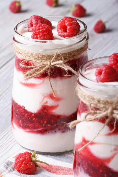 Raspberry dessert in a glass jar closeup vertical — Stock Photo, Image