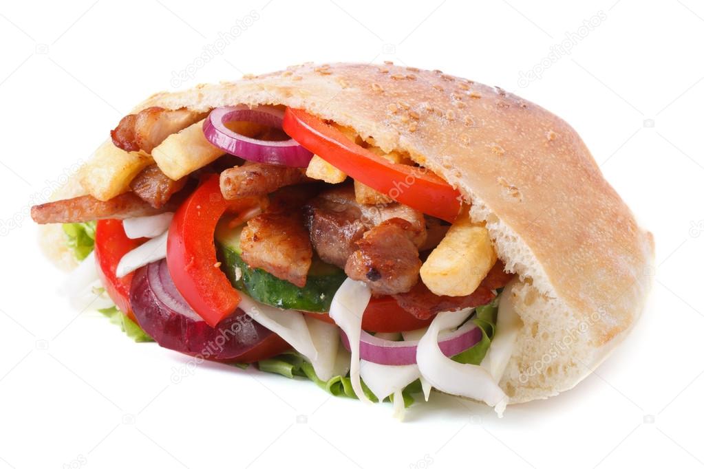 doner with meat, vegetables and fries in pita isolated on white