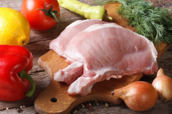 Raw pork meat closeup and fresh vegetables horizontal — Stock Photo, Image