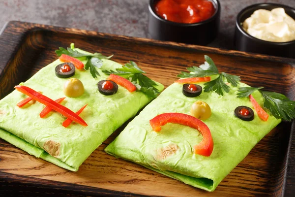 Halloween Fast Food Spinach Burrito Sandwich Funny Face Wooden Tray — стоковое фото