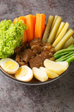 Selat Solo or Javanese Bistik east javanese traditional food indonesian culinary closeup in the bowl on the table. Vertica