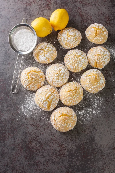 Homemade cookies with lemon flavor closeup on table. Vertical top view from abov