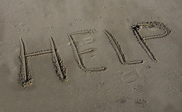 Help in the sand Royalty Free Stock Images