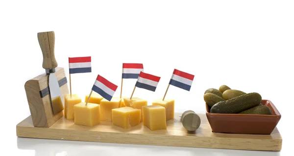 Dutch cheese and pickle with red white blue flag — Stock Photo, Image