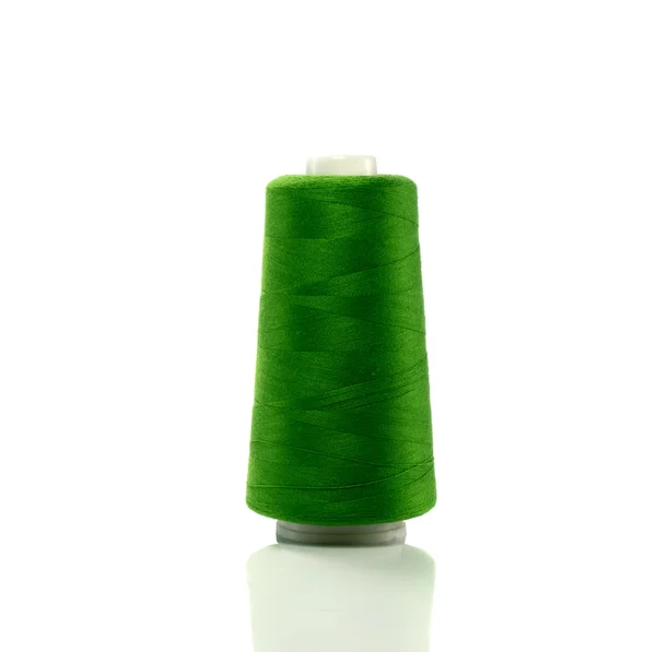 Green bobbin with thread — Stock Photo, Image