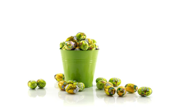 Green bucket with easter eggs — Stock Photo, Image