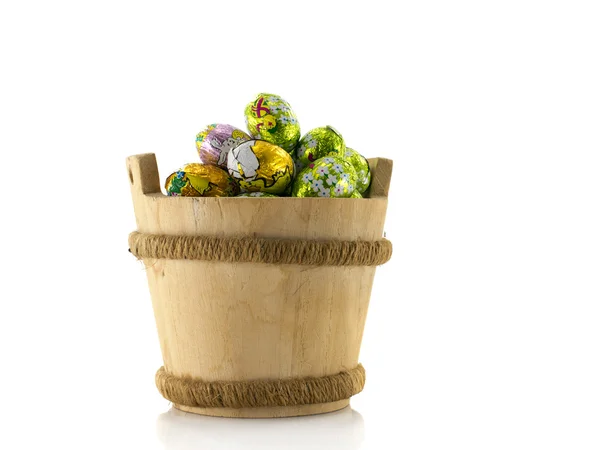 Wooden bucket with easter eggs — Stock Photo, Image