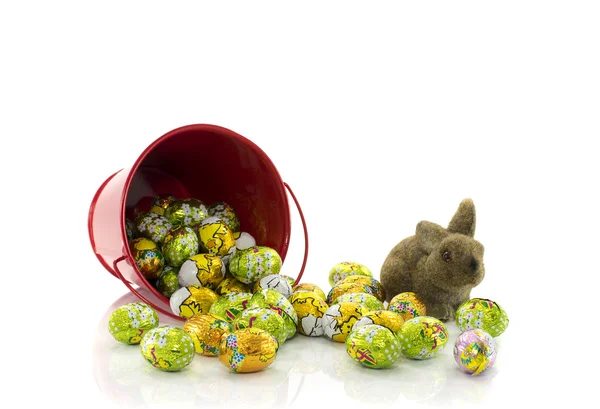 Red bucket with easter eggs — Stock Photo, Image