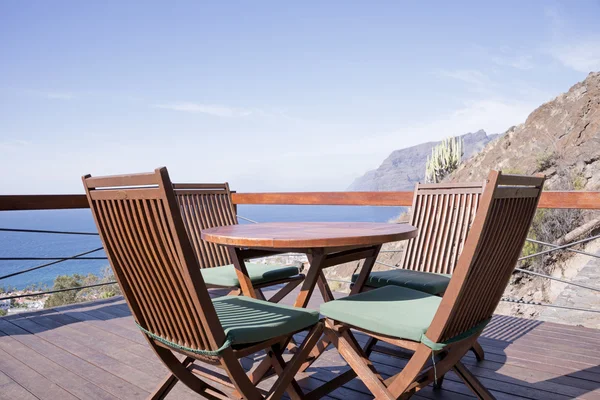 Wooden chairs on tropical terrace — Stock Photo, Image