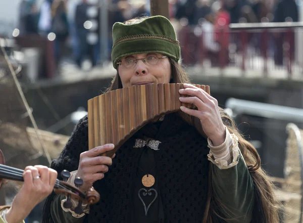 Woman playing panflute — Stock Photo, Image