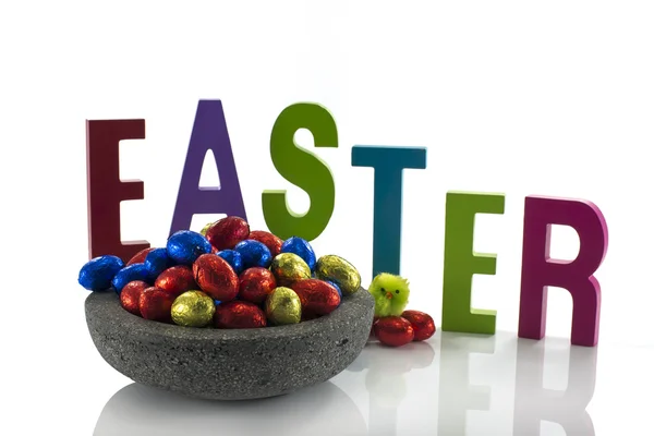 Concrete dish with easter eggs — Stock Photo, Image