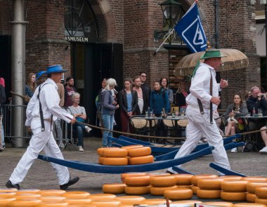 Alkmaar,holland,26-07-2022:Cheese auction on the market in Alkmaar, Netherlands. This traditional spectacle is every friday in summer and you can always find a lot of tourists The cheese carriers are