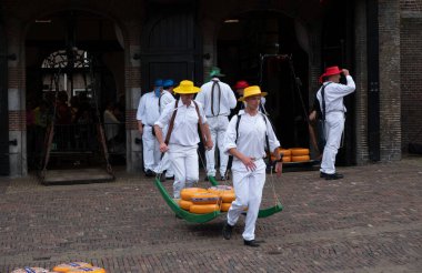 Alkmaar,holland,26-07-2022:Cheese auction on the market in Alkmaar, Netherlands. This traditional spectacle is every friday in summer and you can always find a lot of tourists The cheese carriers are