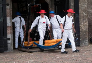 Alkmaar,holland,26-07-2022:Cheese auction on the market in Alkmaar, Netherlands. This traditional spectacle is every friday in summer and you can always find a lot of tourists The cheese carriers are