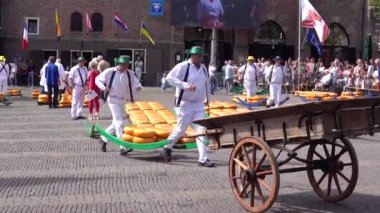 Alkmaar,holland,26-07-2022:Cheese auction on the market in Alkmaar, Netherlands. This traditional spectacle is every friday in summer and you can always find a lot of tourists The cheese carriers are