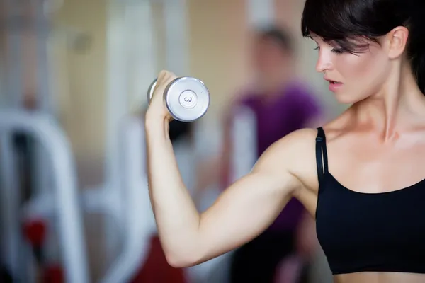 Girl with dumbbells — Stock Photo, Image