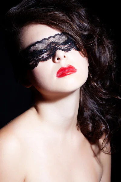 Brunette in a lace mask — Stock Photo, Image
