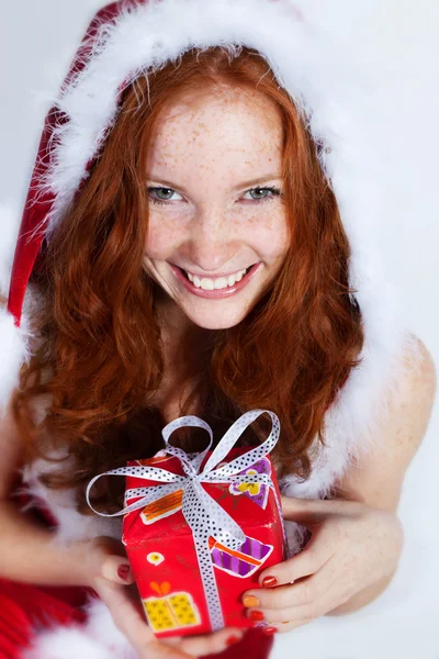 Redhead girl with presents — Stock Photo, Image