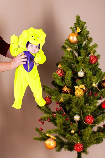 Baby near christmas pine — Stock Photo, Image