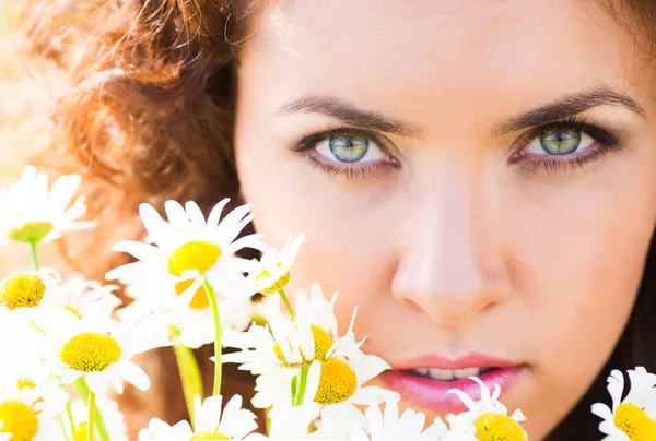 Girl on camomile meadow — Stock Photo, Image