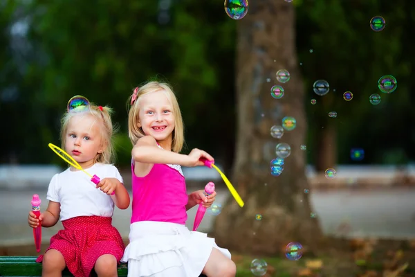 Two little girl with bubbles — Stock Photo, Image