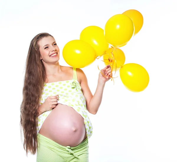 Беременная женщина с воздушными шарами — стоковое фото
