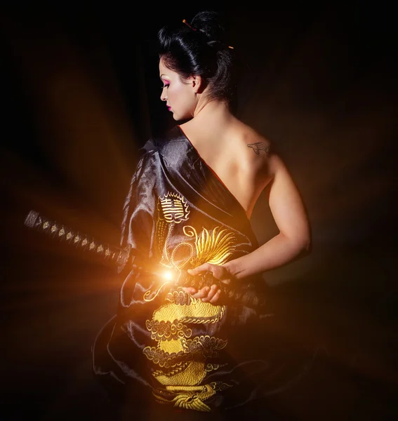 Woman with japan sword katana in hands — Stock Photo, Image