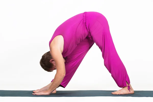 Man making yoga figure — Stock Photo, Image