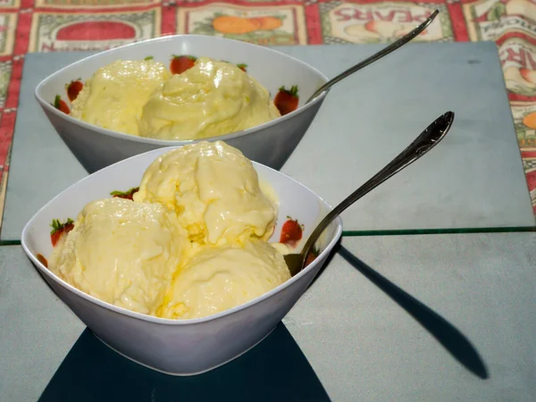 Ice cream scoops from mango in a bowl