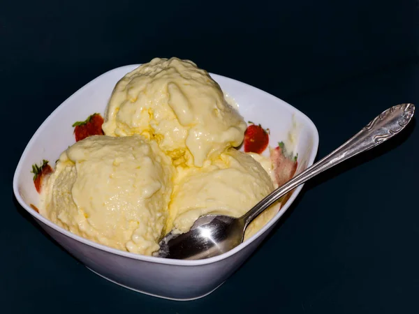 Ice cream scoops from mango in a bowl