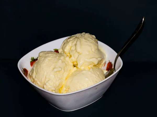 Ice cream scoops from mango in a bowl