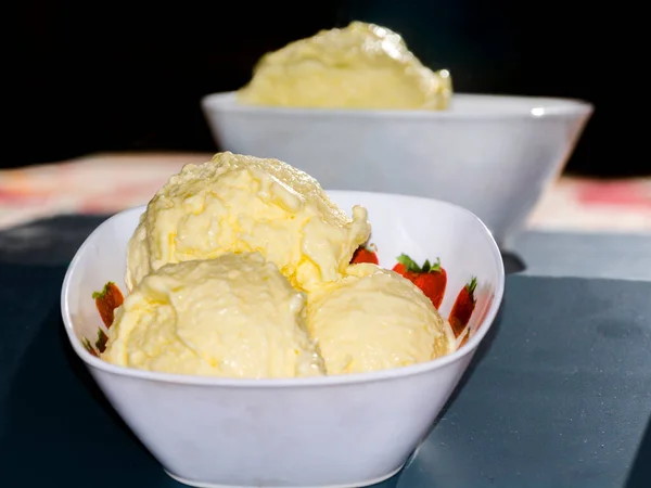 Ice cream scoops from mango in a bowl