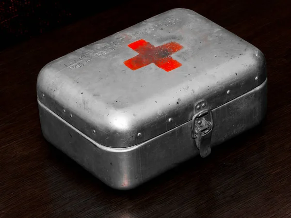 Retro iron first aid box in the dark