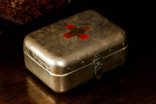 Retro iron first aid box in the dark