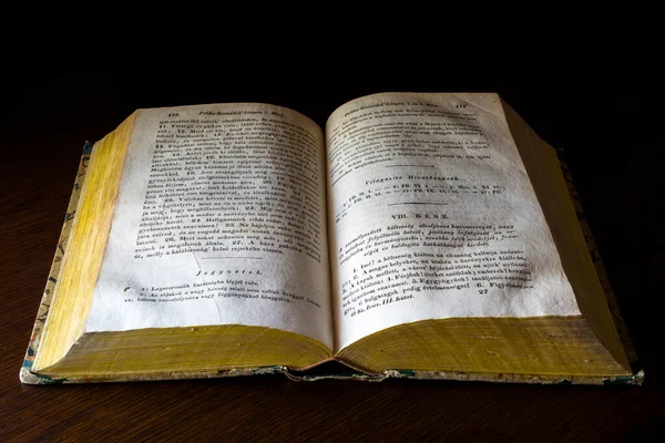 BALATONKENESE, HUNGARY - AUGUST 14. 2022: Old Bible on a wooden table