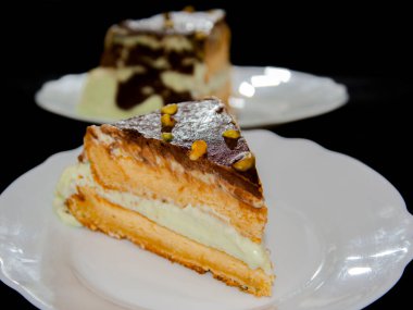 Pistachio cream cake on a white dish