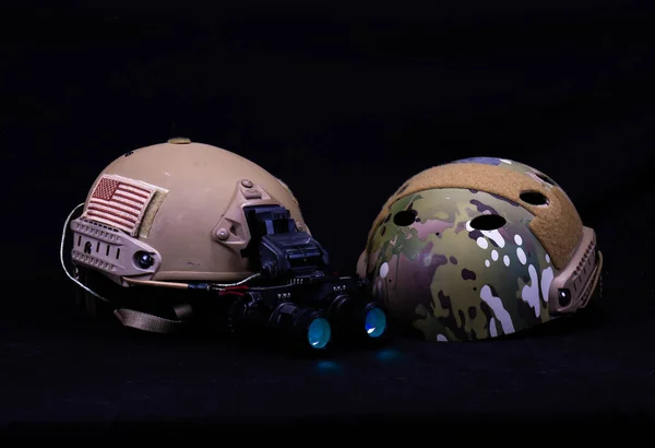 Two American Military Helmets, One With Night Vision Goggles
