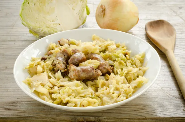 Cabbage stew and pork sausage — Stock Photo, Image