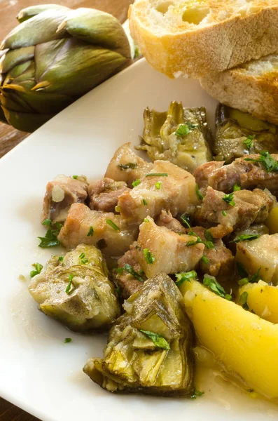 Stew of pork with artichoke and potato, italian cuisine — Stock Photo, Image