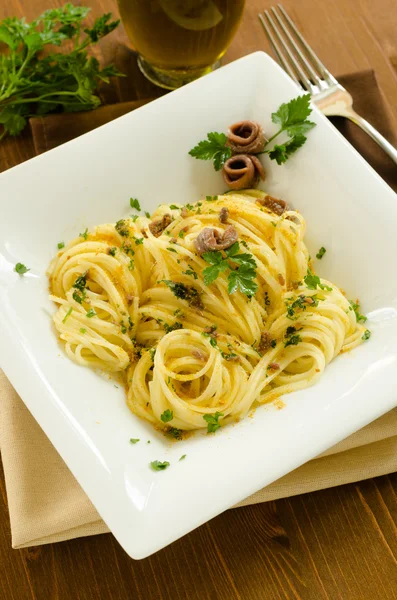 Спагетті з бунгало і анчоусами — стокове фото